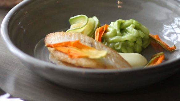 Of the sea: john dory fillets with squid noodles, zucchini flowers and spicy fish broth.