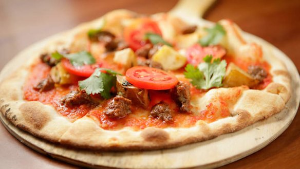 Pizza with house-made lamb sausage.