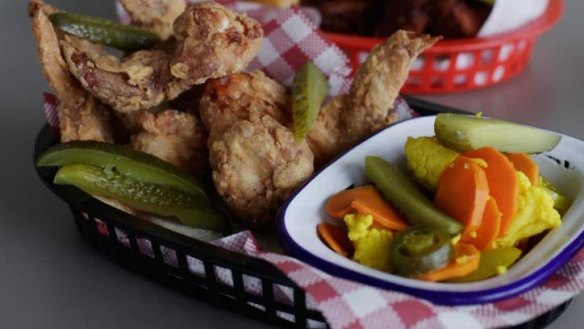 Chicken wings and pickles at Belles Hot Chicken pop-up.