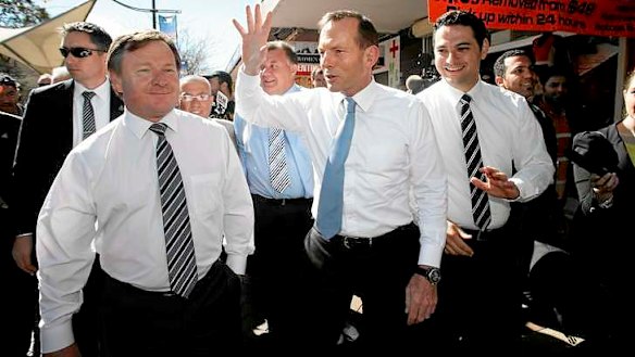 Tony Abbott campaigning with Kent Johns, left.