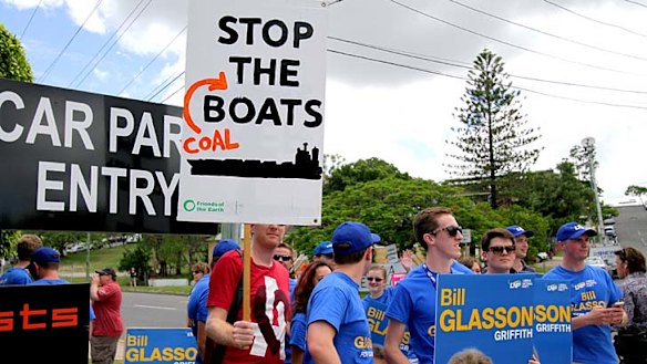 One of a group of protesters waits for Prime Minister Tony Abbott to arrive at Bill Glasson's  campaign launch.