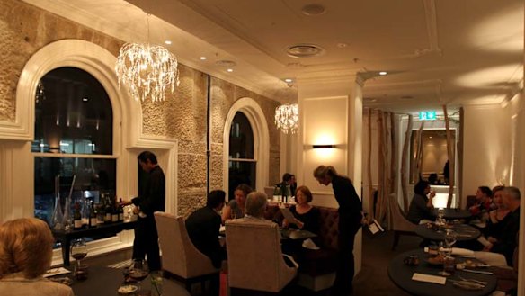Setting the tone ... crystal chandeliers and tables covered with ostrich skin.