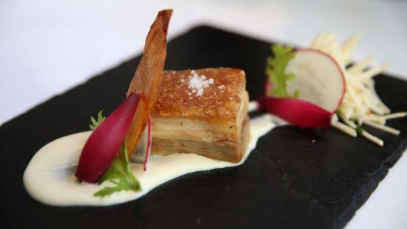 Braised pork belly with apple slaw, pickled cauliflower and spiced fennel puree.