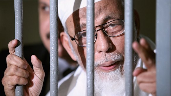 Radical cleric Abu Bakar Bashir is seen behind bars before his hearing verdict at the South Jakarta District Court in 2011.