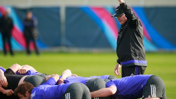 Famous family: Simon's uncle, Mike Cron, instructs the All Blacks forwards.