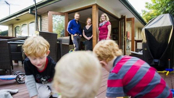 Help at hand: The Hayes family, Brenden, Katherine, Zane, 5, Aiden, 3, and Diesel 1, and with their au pair Larissa Hettich.