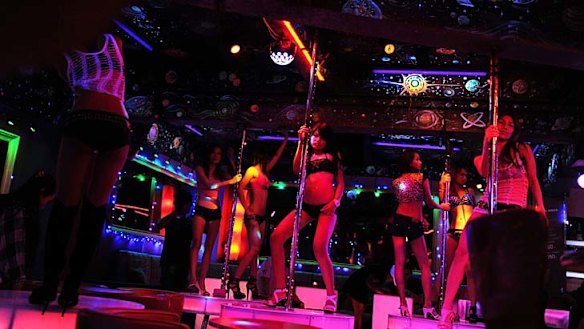 Bangkok's red-light districts - where scantily-clad girls dance on stage and touts compete to lure visitors into shows involving bananas and ping pong balls - are firmly on the tourist trail.