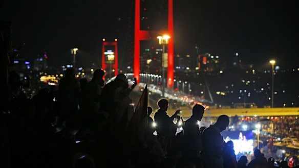 Pro-government supporters head their leaders call for loyalty at Istanbul's iconic Bosporus Bridge.