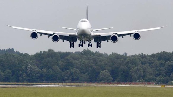 The first Lufthansa Boeing 747-8 Intercontinental flight touches down at Dulles International Airport outside Washington.