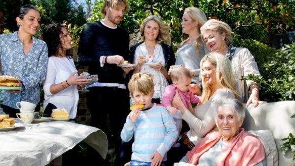 Margaret Fulton (front) with family and friends, including Carol and Sharon Salloum, Darren Robertson, Magdelena Roze, and Kate, Louise and Suzanne Gibbs, and great-grandchildren Harry, 5, and five-month-old Charlotte.