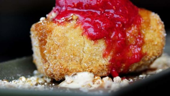 Deep-fried cheesecake on a bed of popcorn.