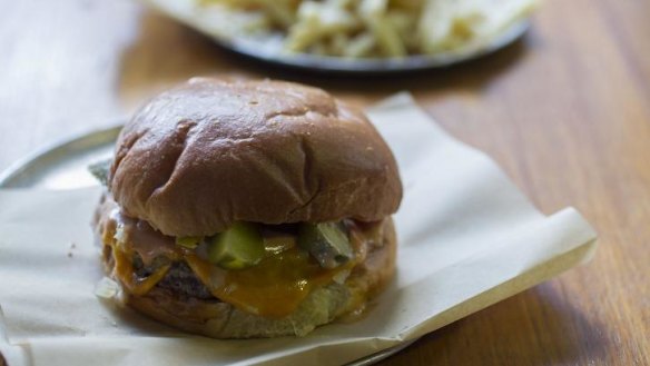 Thick, meaty, and cheesy: The 'Yezzus burger' at The Roots Next Door.