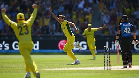 Clean bowled: Mitchell Starc celebrates taking the wicket of Brendon McCullum during the World Cup final.