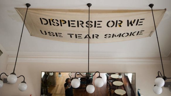 Amusing curios: An old police banner is pinned to the ceiling.