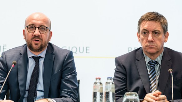 Belgian Prime Minister Charles Michel, left, and Belgium's Interior Minister Jan Jambon address the media in the wake of the attacks.