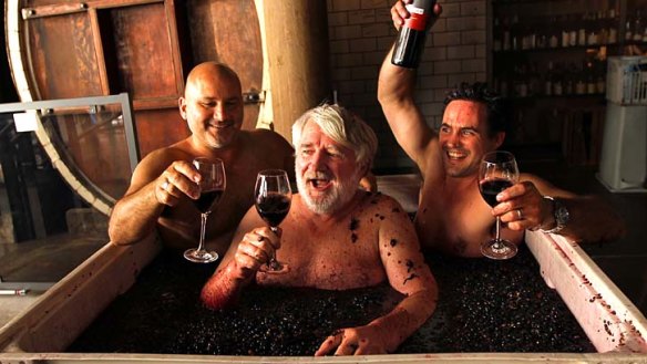 Nectar of the odds: Alex Retief, right, master of wine Rob Geddes, centre, and director of Nomad, Al Yazbeck, do some fair-dinkum squishing at Nomad in Surry Hills.