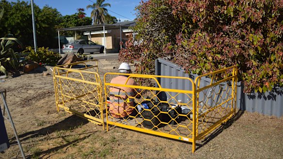 A technician installs NBN in front of a home in Wanneroo.