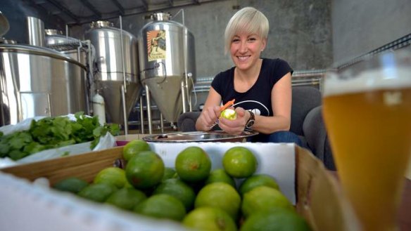 Jayne Lewis, who uses limes in her beer, hard at work. 'We've used a little bit of corn, thrown in coriander leaf and a whole stack of lime,' she says.