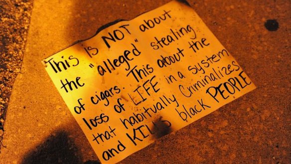 A placard dropped by a protester at Sunday night's demonstration in Ferguson, Missouri.