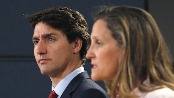 "Totally unacceptable": Canadian Prime Minister Justin Trudeau, left, and Canadian Foreign Affairs Minister Chrystia Freeland hold a news conference in Ottawa on Thursday. 