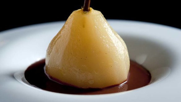 Poached pears with chocolate sauce.