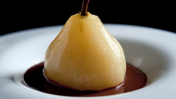 Poached pears with chocolate sauce.