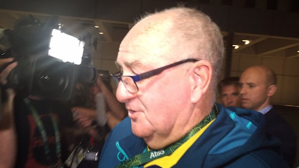 AOC head of security Greg Nance arrives at the police station where Australian athletes were being held.