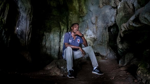 Hassaballa Hassaballa, a Sudanese refugee, in a cave locals used as shelter during World War II, on Los Negros Island near Manus.