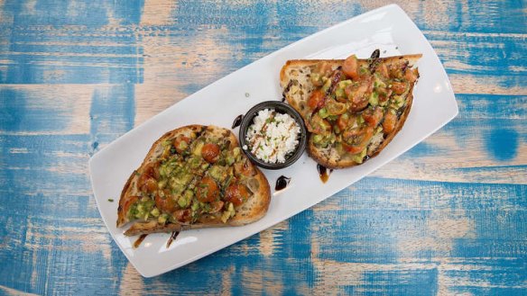 Avocado and tomato breakfast bruschetta.