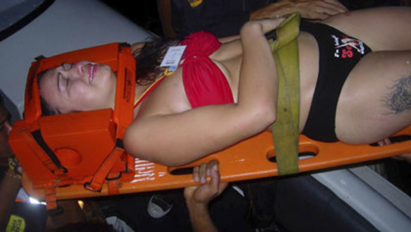 Rescue ... an unidentified partygoer receives medical help.