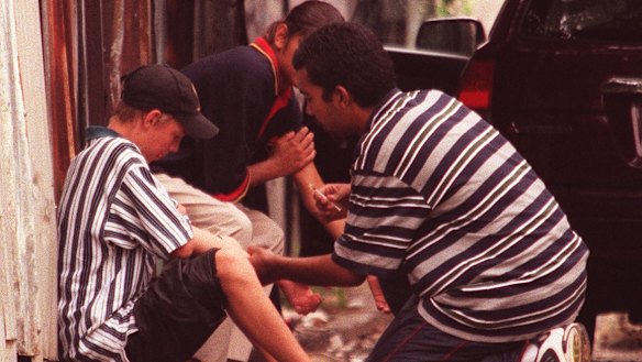 Heroin users on the footpath in Redfern in 1999; a Sun-Herald photo that sparked the drug summit. 