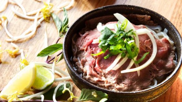 Pho served with DIY shoots and condiments.