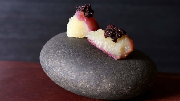 Japanese sweet potato and black olive, served on a stone.