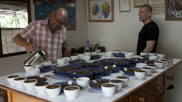 Toby Smith, left, tests out the first crop of coffee beans from his new farm in Santa Clara, Panama, earlier this year.