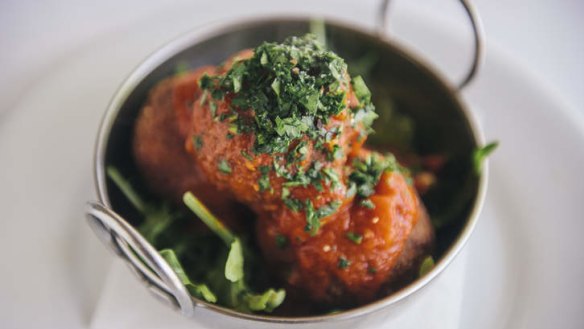 Arancini with tomato sauce.