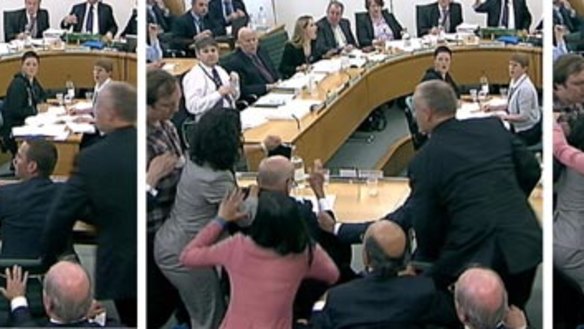 Wendi Deng flies at her husband's attacker.