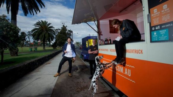 Jack White, The Brulee Cart owner (left) and Riley Woosnam and Maddison Chadderton of Mr Burger in Yarraville Gardens.