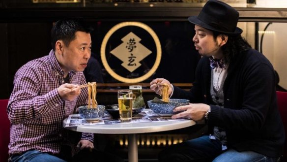 Masahiko Iga (left) and Yoshi Kurosawa share ramen at Yoshi's ramen bar called Mugen. 