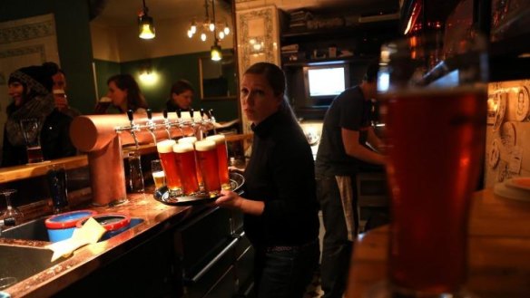 Beer bar: A waitress at Hops & Barley brewpub carries beer.