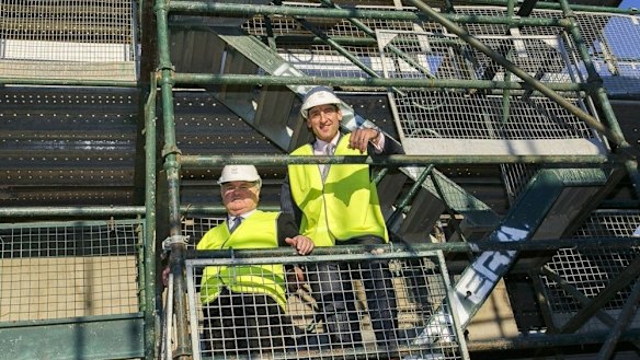 Outgoing Village Building Company managing director Bob Winnel with new chief executive officer Travis Doherty.