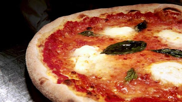 Wood-fired ... margherita pizza topped with fior di latte mozzarella, tomato sauce and fresh basil leaves.