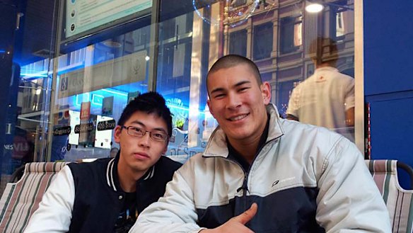 John Kim, 19, and Russell Lee, 20. John plans to sell his $2 Galaxy S II and Russell plans to keep his.