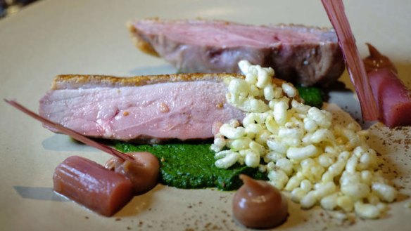Duck breast with potato puffs, spinach and rhubarb.
