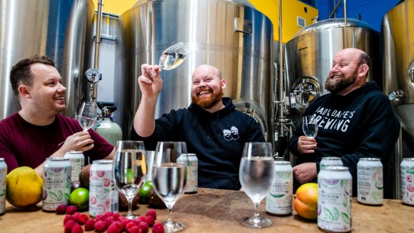 Brothers James and Dave Dumay, with their father John and their new alcoholic sparkling waters from Dad and Dave Brewing at Brookvale.  