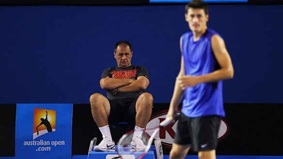 Bad reputation: Bernard Tomic's father John watches him during a practice session prior to the 2012 Australian Open at Rod Laver Arena.