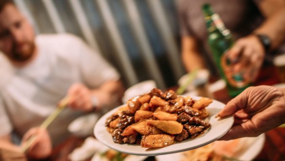 Eating stir-fried beef and potatoes in Sham Sui Po. "The whole lot gets deep fried before it gets coated in the addictive sauce,” says Friesen.