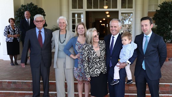 Tom Hughes (left) with Prime Minister Malcolm Turnbull and his family at Government House following his swearing in on Tuesday.