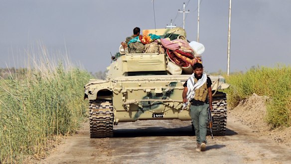 Shiite Popular Mobilisation forces prepare to attack Islamic State positions at Khalidiya Island in Anbar province, Iraq, in August.