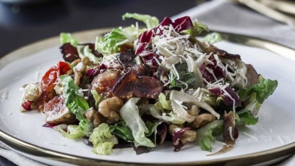 L'Americano signature salad is perfectly dressed.