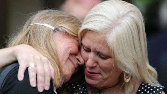Relief ... Doctor Elaine Storkey of Ely (left) reacts as she leaves the venue after members voted to approve the creation of female bishops at the Church of England General Synod in York, northern England.